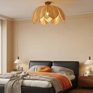 Hanove rattan ceiling light installed in modern master bedroom with leather bed, warm bohemian pendant lighting fixture in minimalist interior