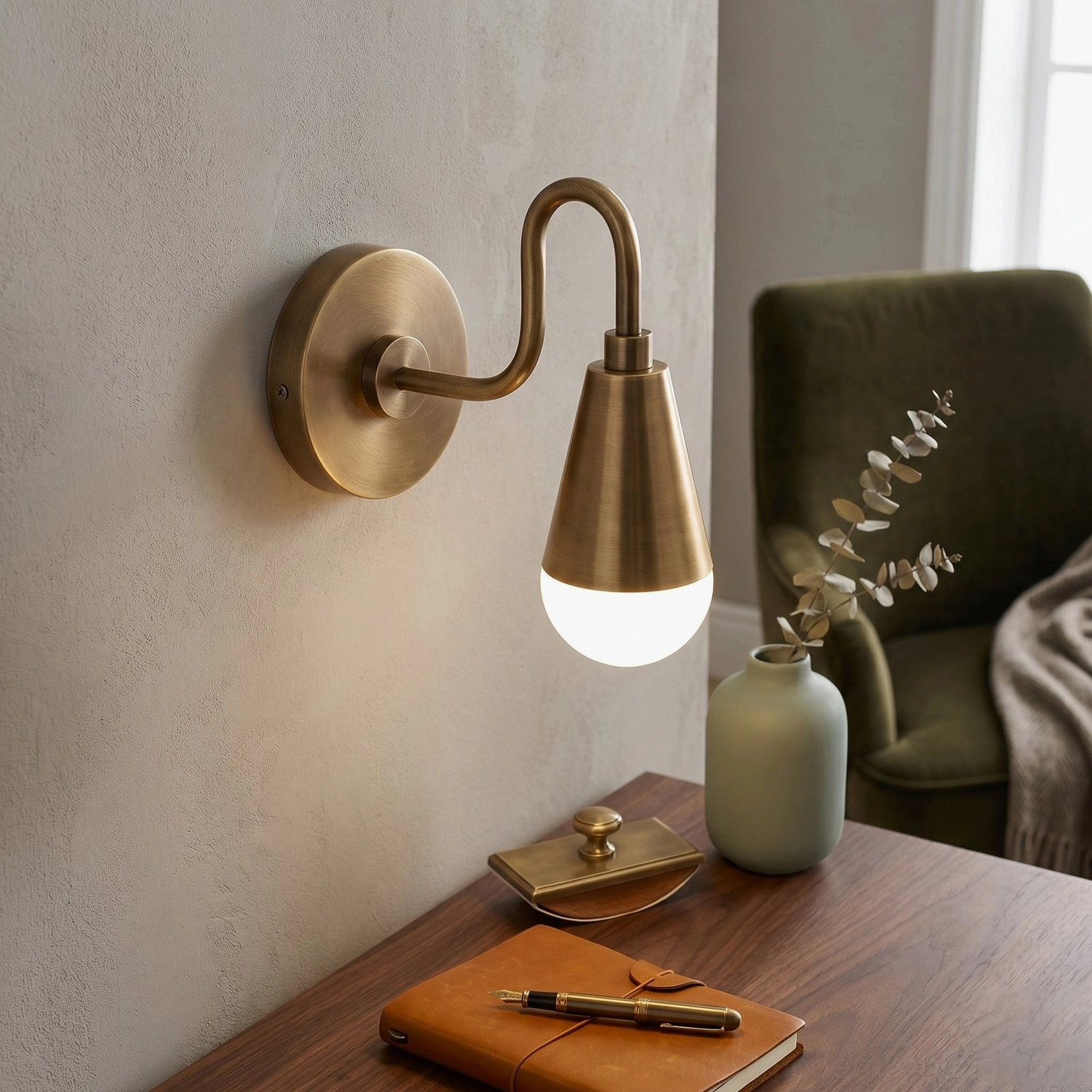 Harlan Gooseneck Sconce side profile at reading corner with wooden side table, aged brass metal, mid-century minimalist style lighting