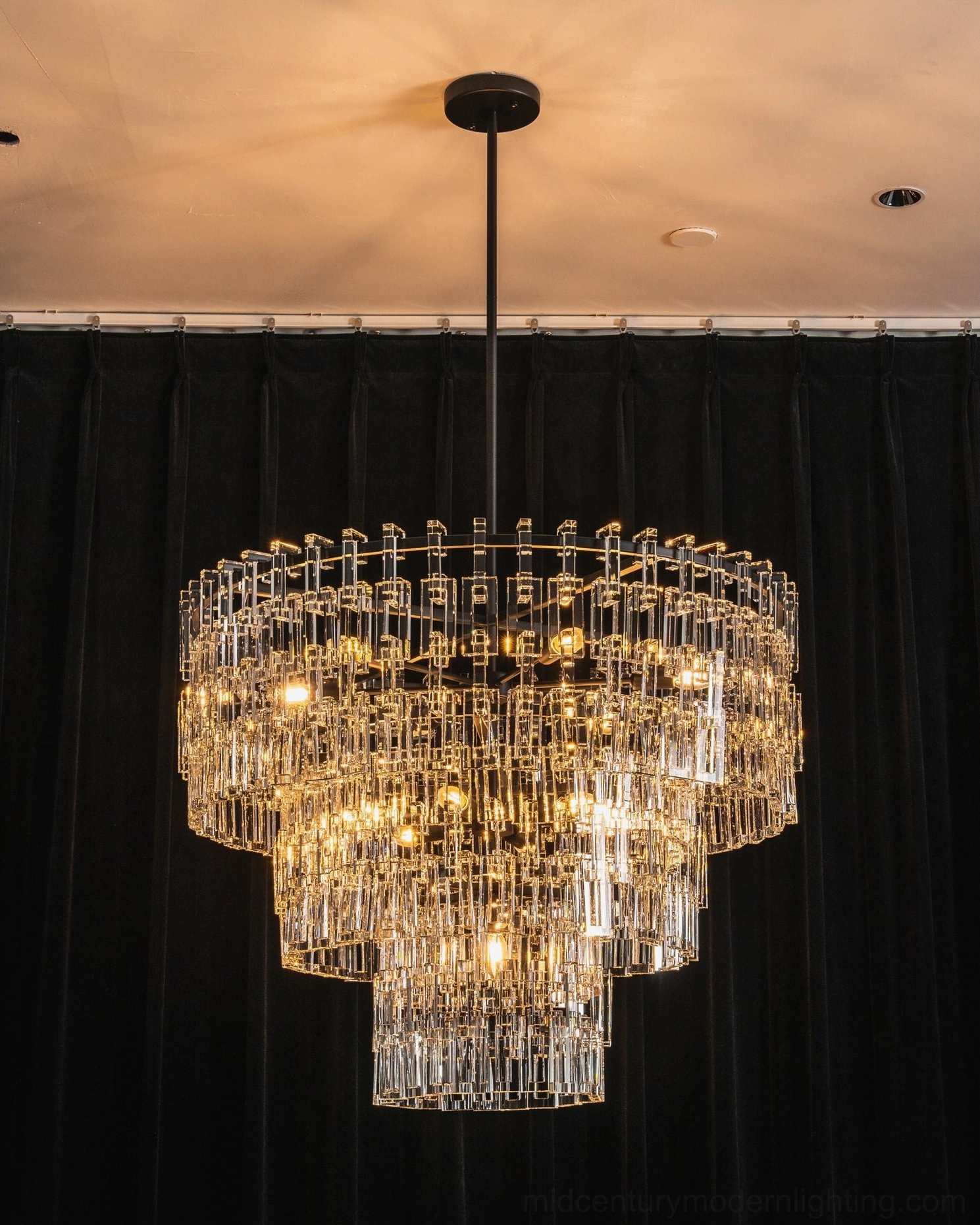 Harlow geometric crystal chandelier showing full tiered crystal prism array and suspension rod detail