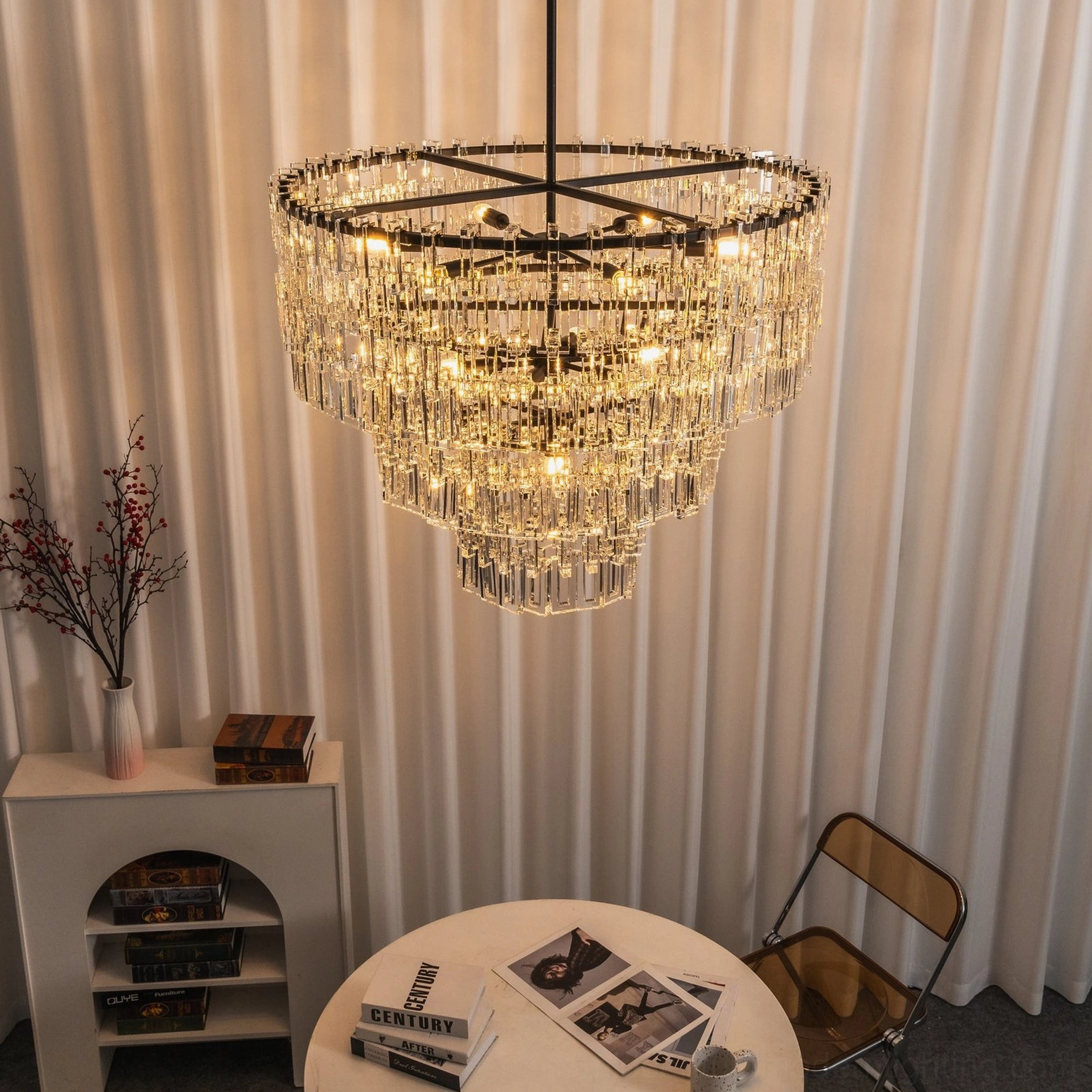 Tiered crystal pendant showing illuminated crystal refraction and geometric light pattern detail