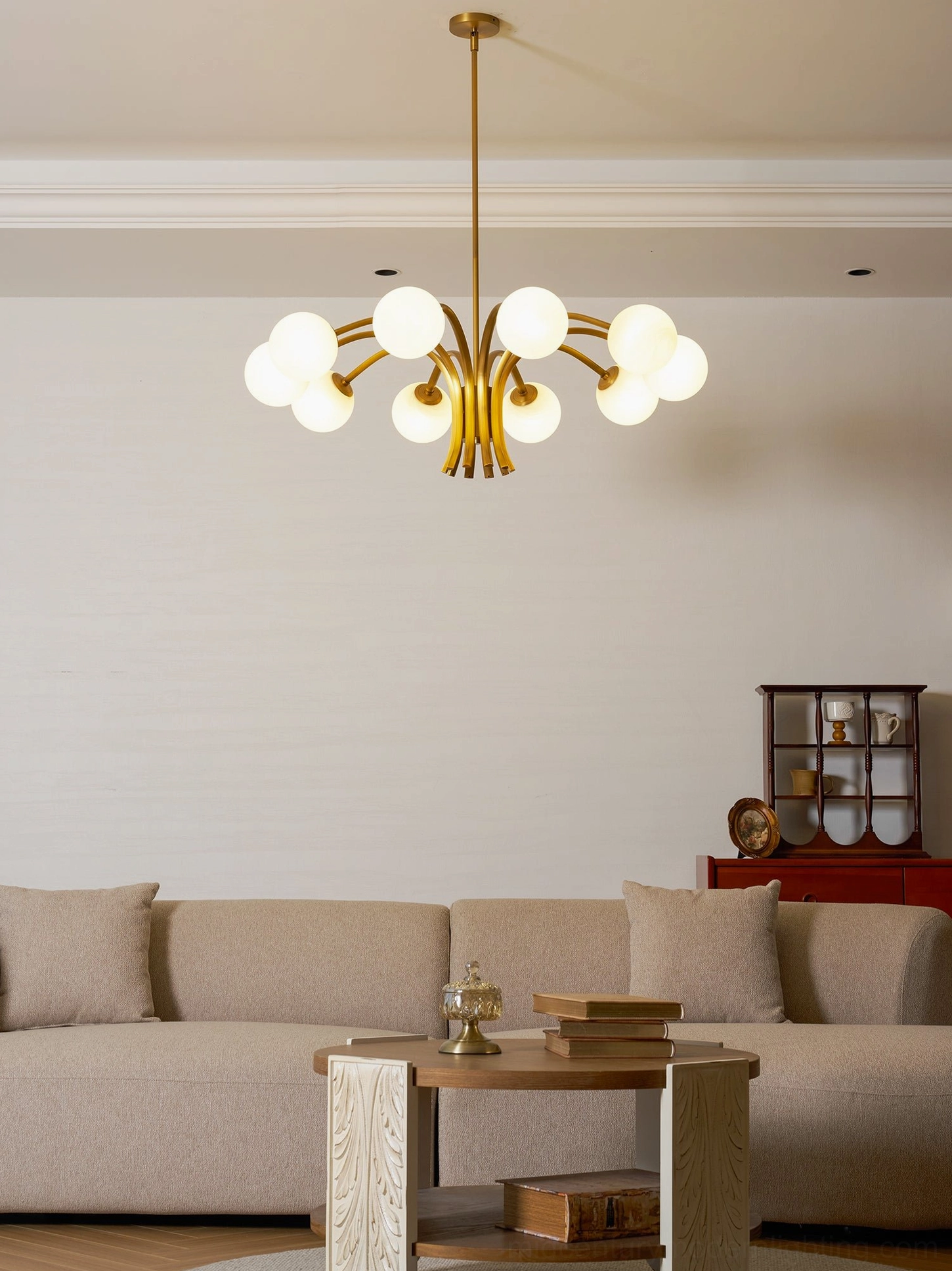 10-light brass globe chandelier with warm metallic finish and diffusing frosted glass shades