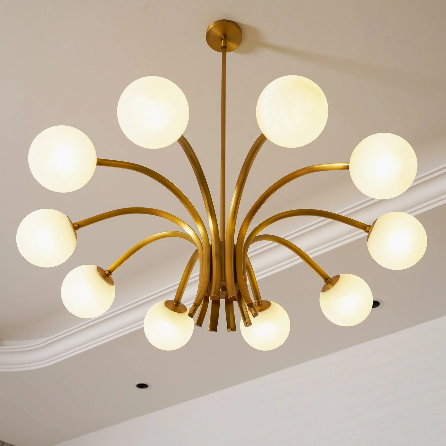 Mid-century modern Havana chandelier with 10 spherical glass globes and warm brass finish