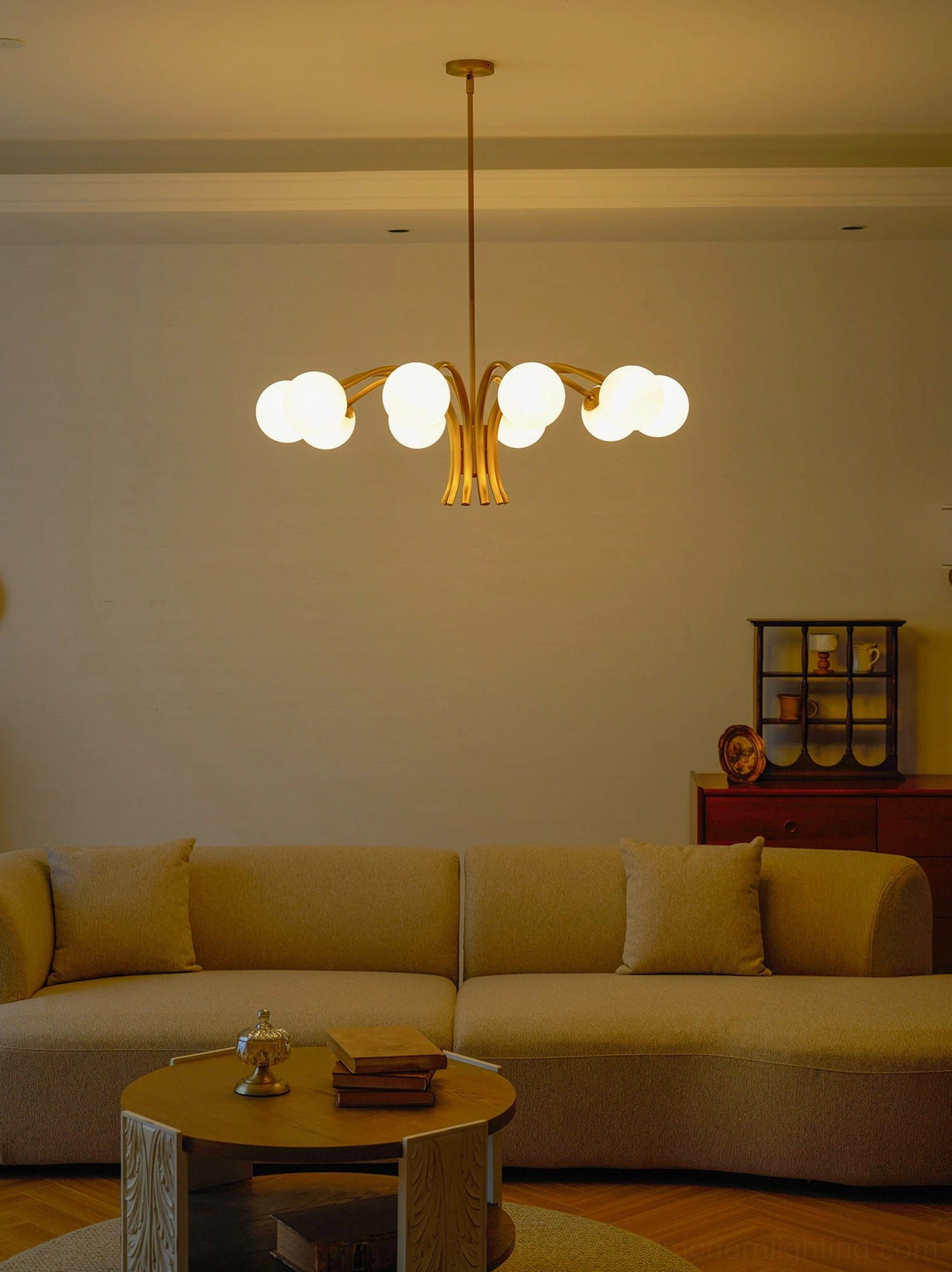 Havana brass globe chandelier featuring polished metal arms and hand-selected frosted glass shades