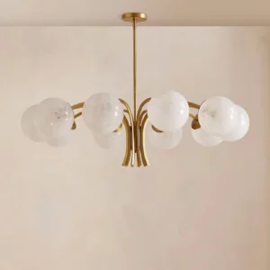 Mid-century modern brass globe chandelier with spherical frosted glass orbs and polished metal arms, angled product view
