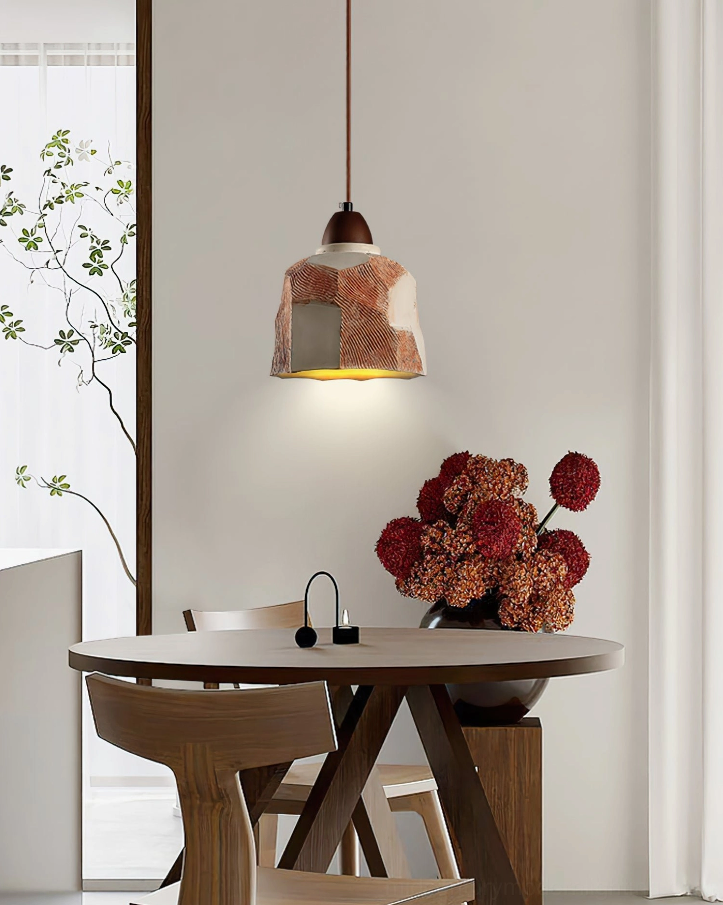 Havre ceramic pendant lamp front view showing two-tone finish and modern sculptural form