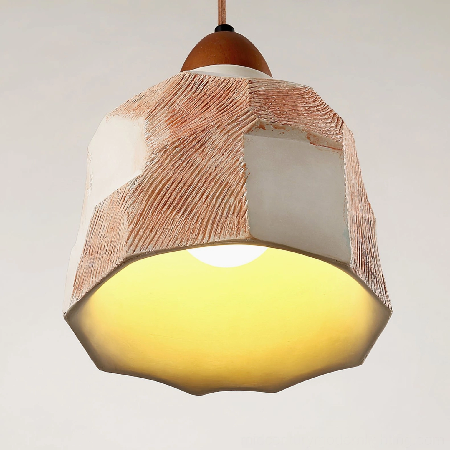 Illuminated Havre pendant light glowing with warm interior light, creating ambient home lighting