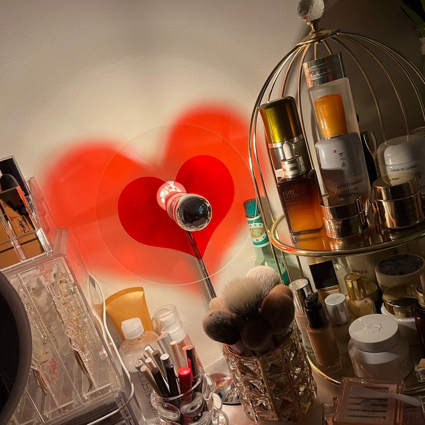 Heart projection lamp in home office workspace creating ambient lighting and emotional design