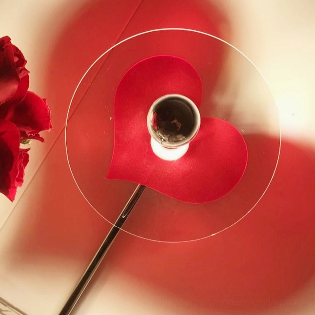 Heart projection lamp creating intimate romantic atmosphere in contemporary home setting