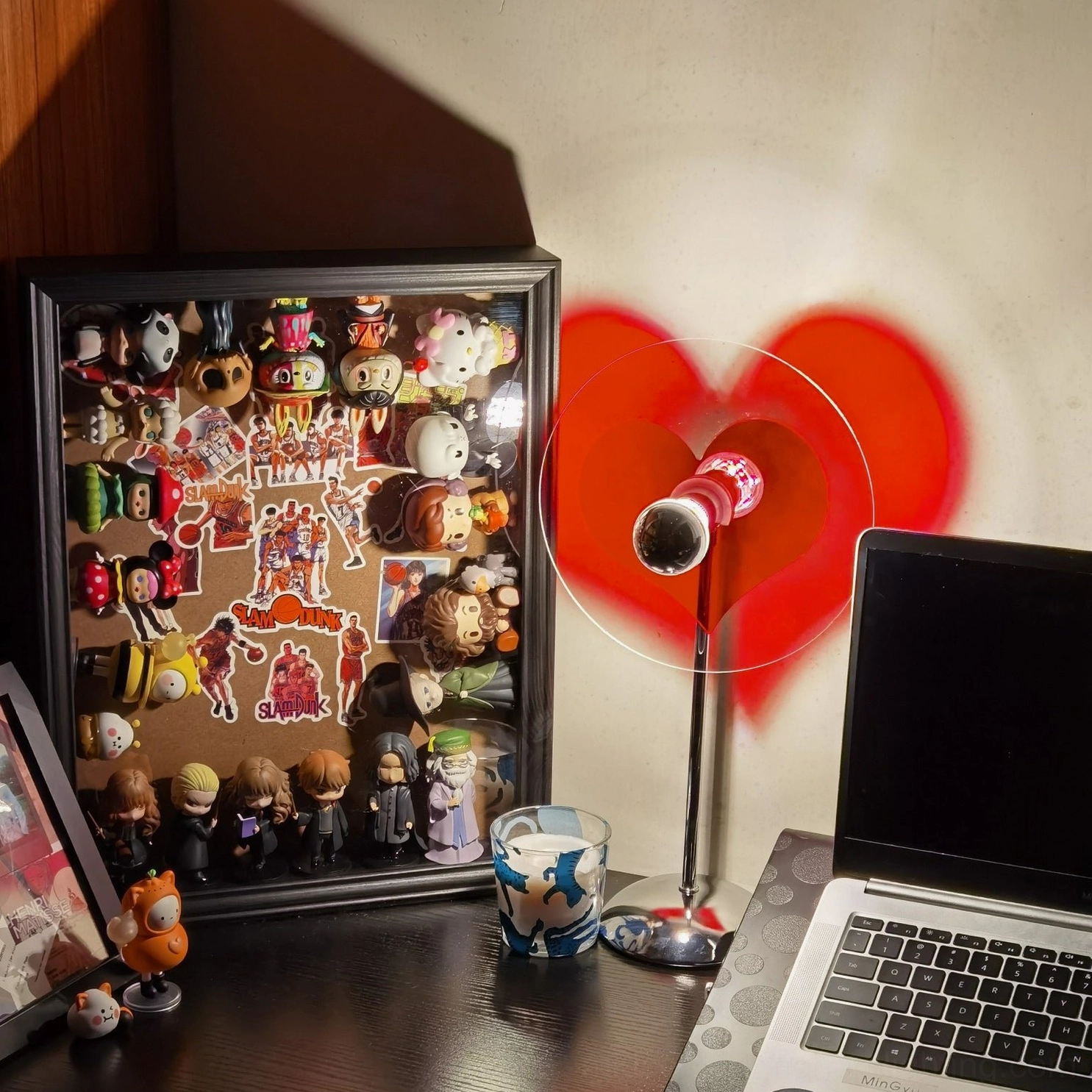 Heart projection lamp detail showing metal frame construction and acrylic shade engineering