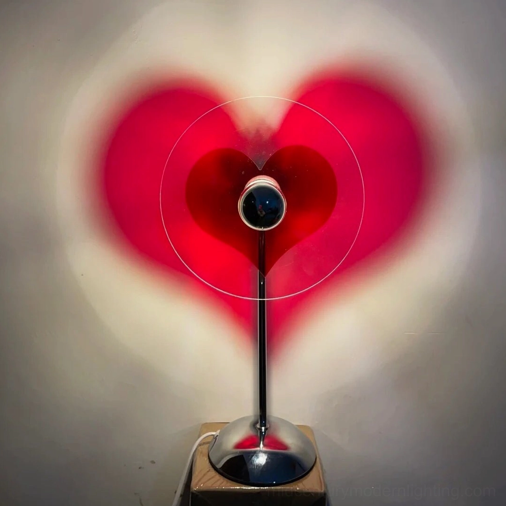 Heart projection lamp casting warm romantic glow in reading nooks and personal retreat spaces