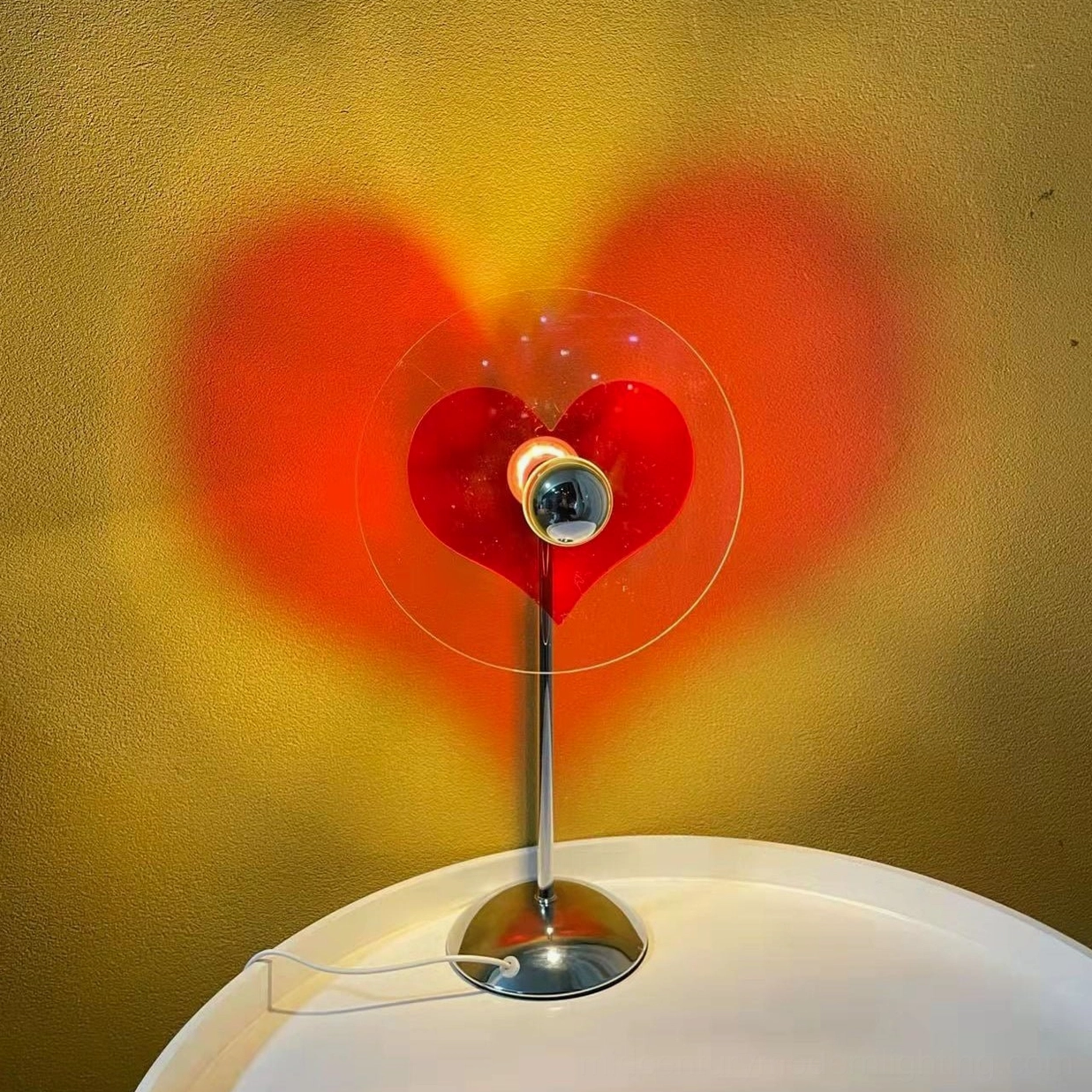 Heart projection table lamp as thoughtful gift for loved ones, friends, and family members celebrating connection