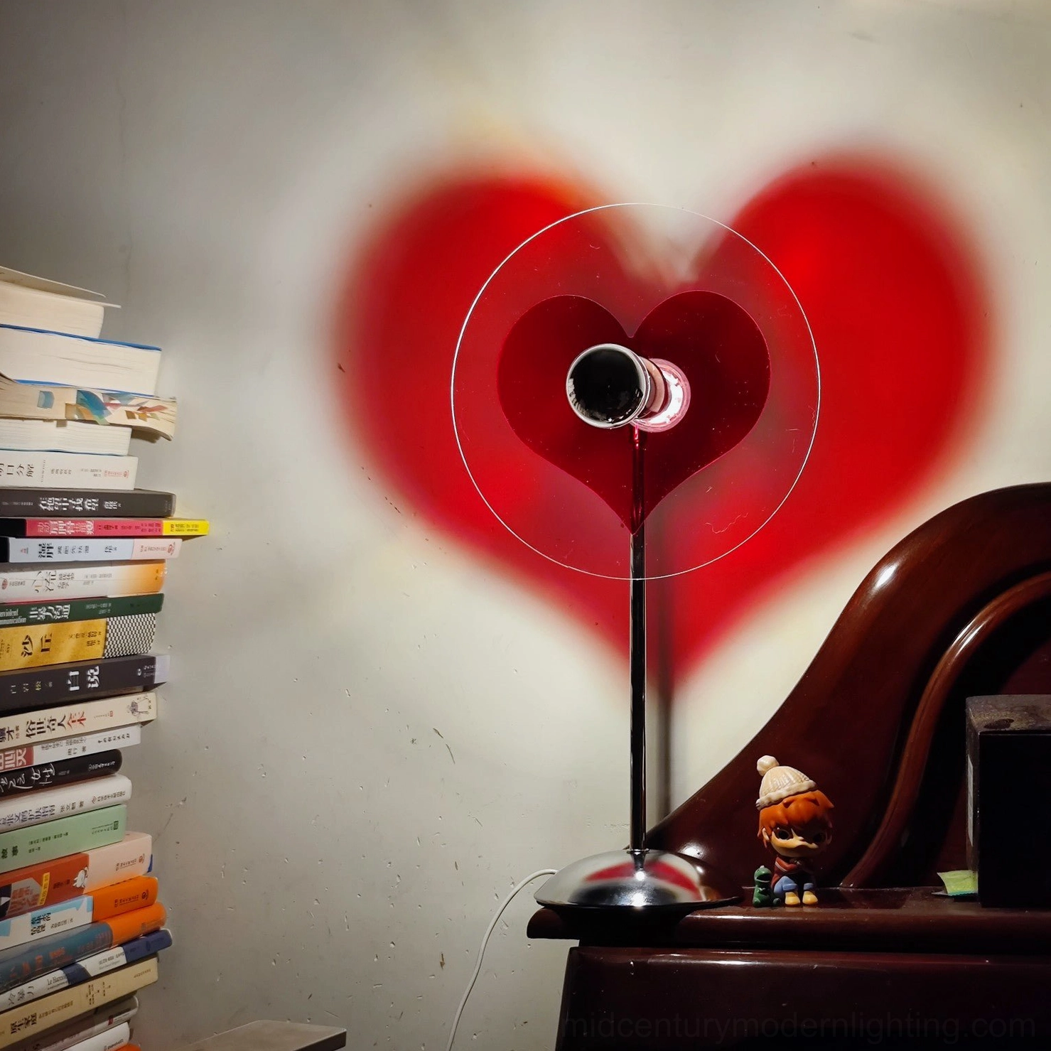 Heart-shaped LED lamp showing clear acrylic components and chrome metal construction detail
