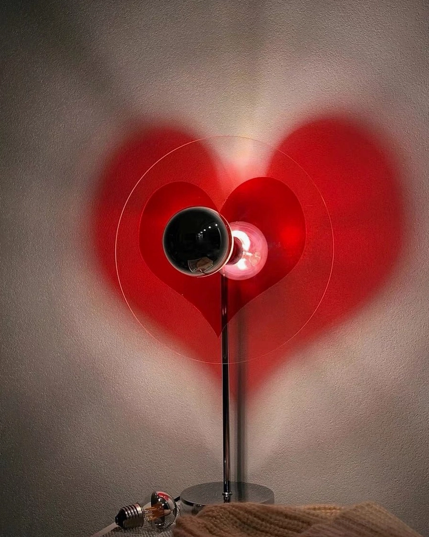Heart-shaped LED lamp on bedroom vanity, practical and decorative lighting for personal spaces