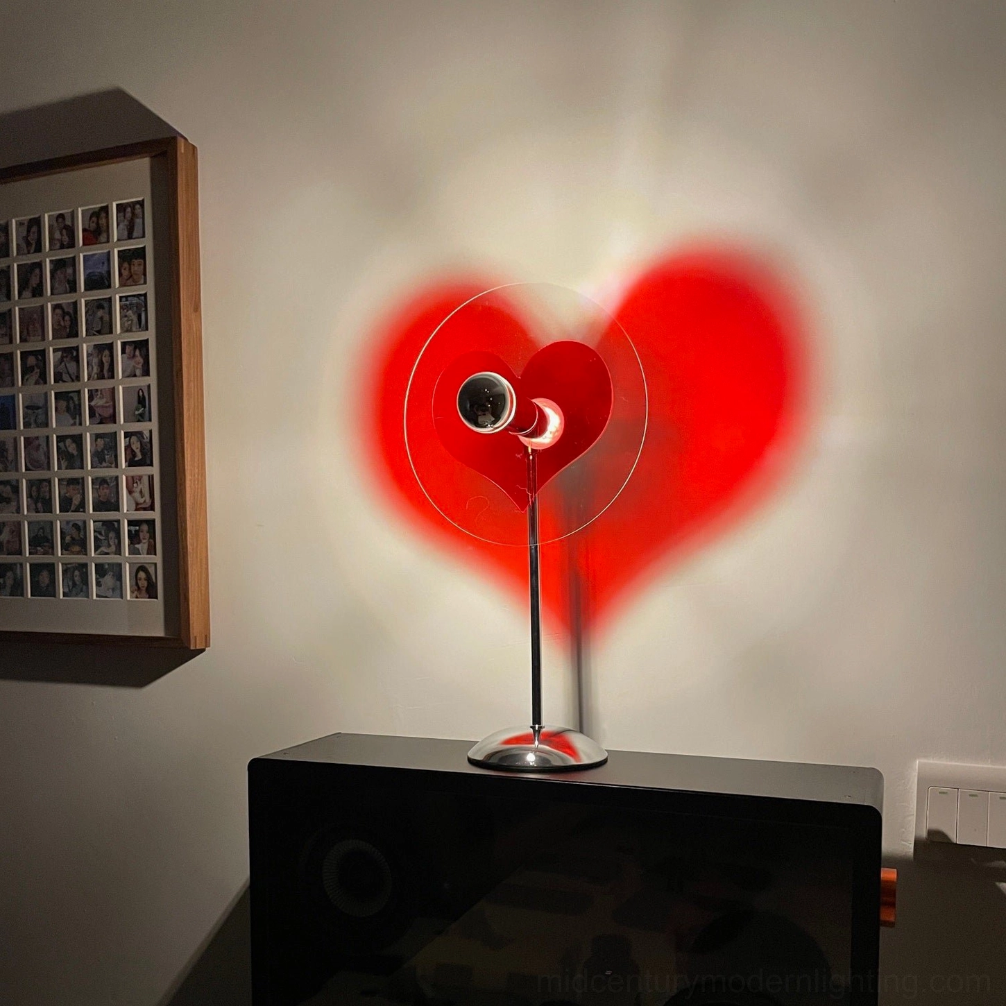 Heart-shaped lamp with clear acrylic base design providing visual lightness and modern sophistication
