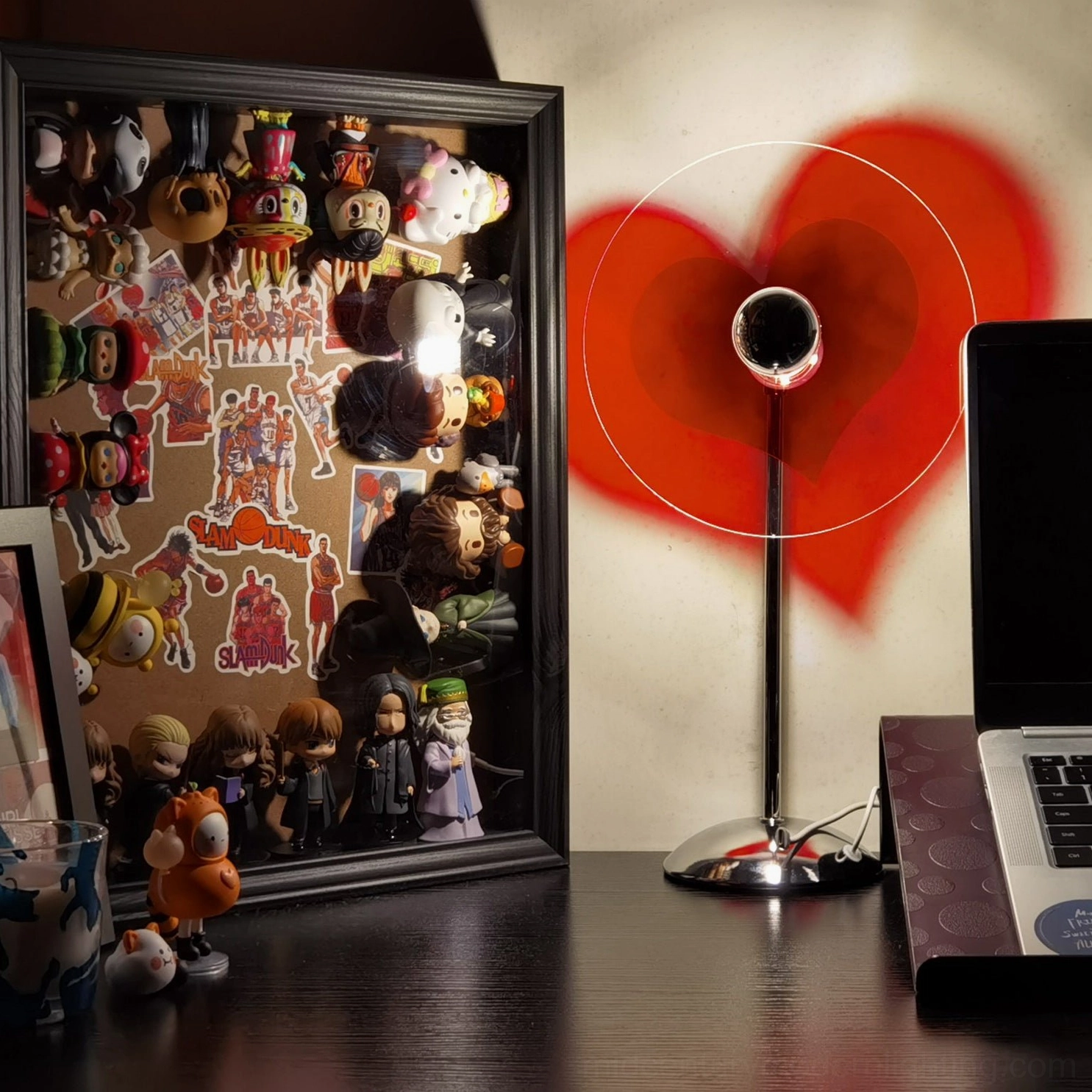 Heart-shaped LED lamp in contemporary bedroom setting demonstrating emotional design aesthetic