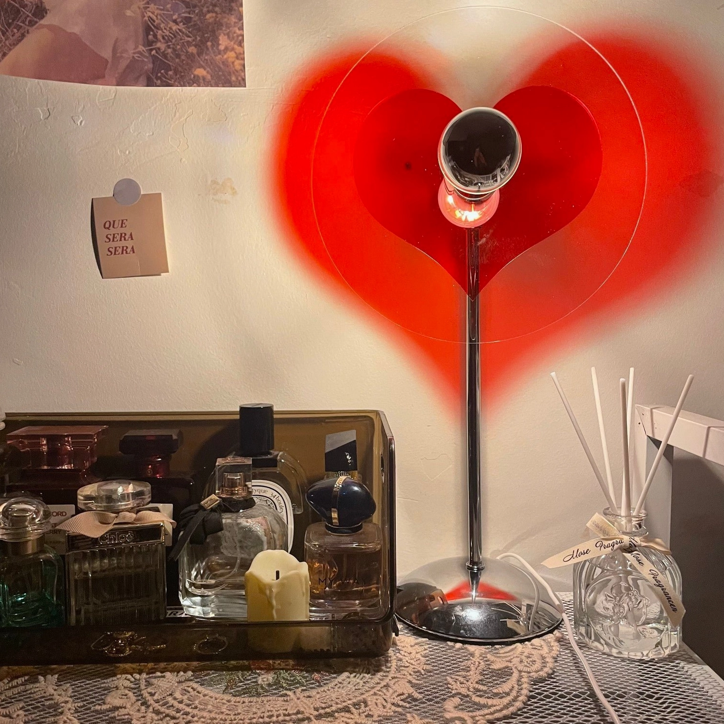 Heart-shaped LED table lamp in various finish options including chrome and red variants