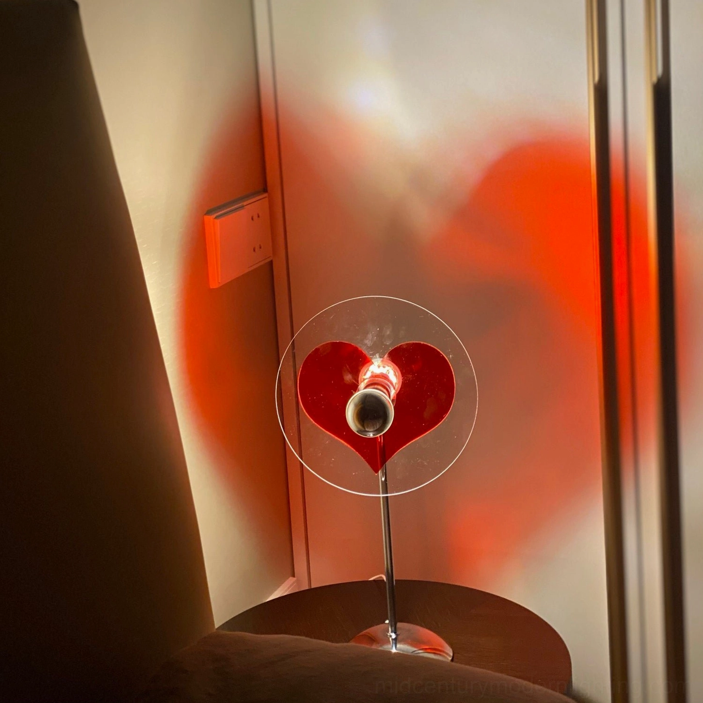 Heart-shaped table lamp transforming quiet corners into emotionally resonant gathering places and moments