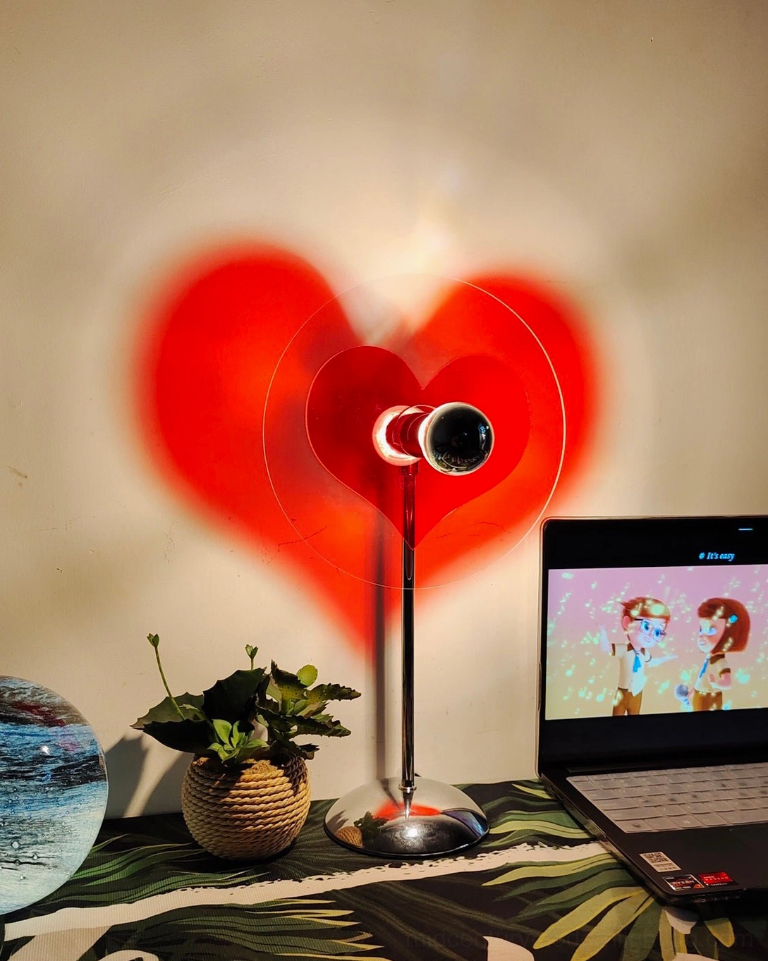 Heart-shaped LED lamp combining sustainable rechargeable battery technology with contemporary aesthetic appeal