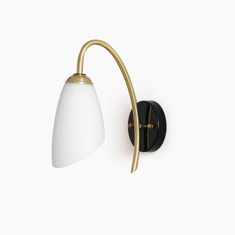 Hector unlit curved brass wall sconce with black base mounting on white background