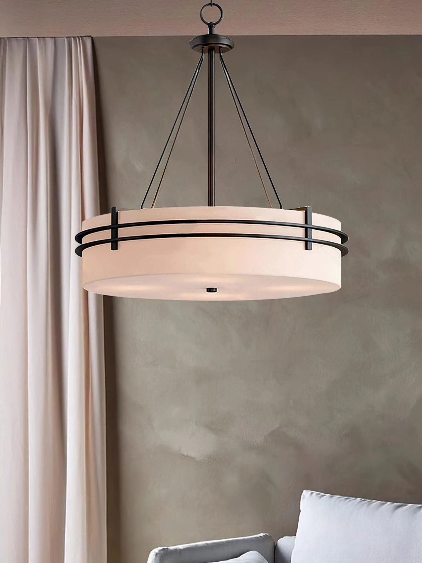 Heddle pendant chandelier installed in residential dining room with warm lighting ambiance