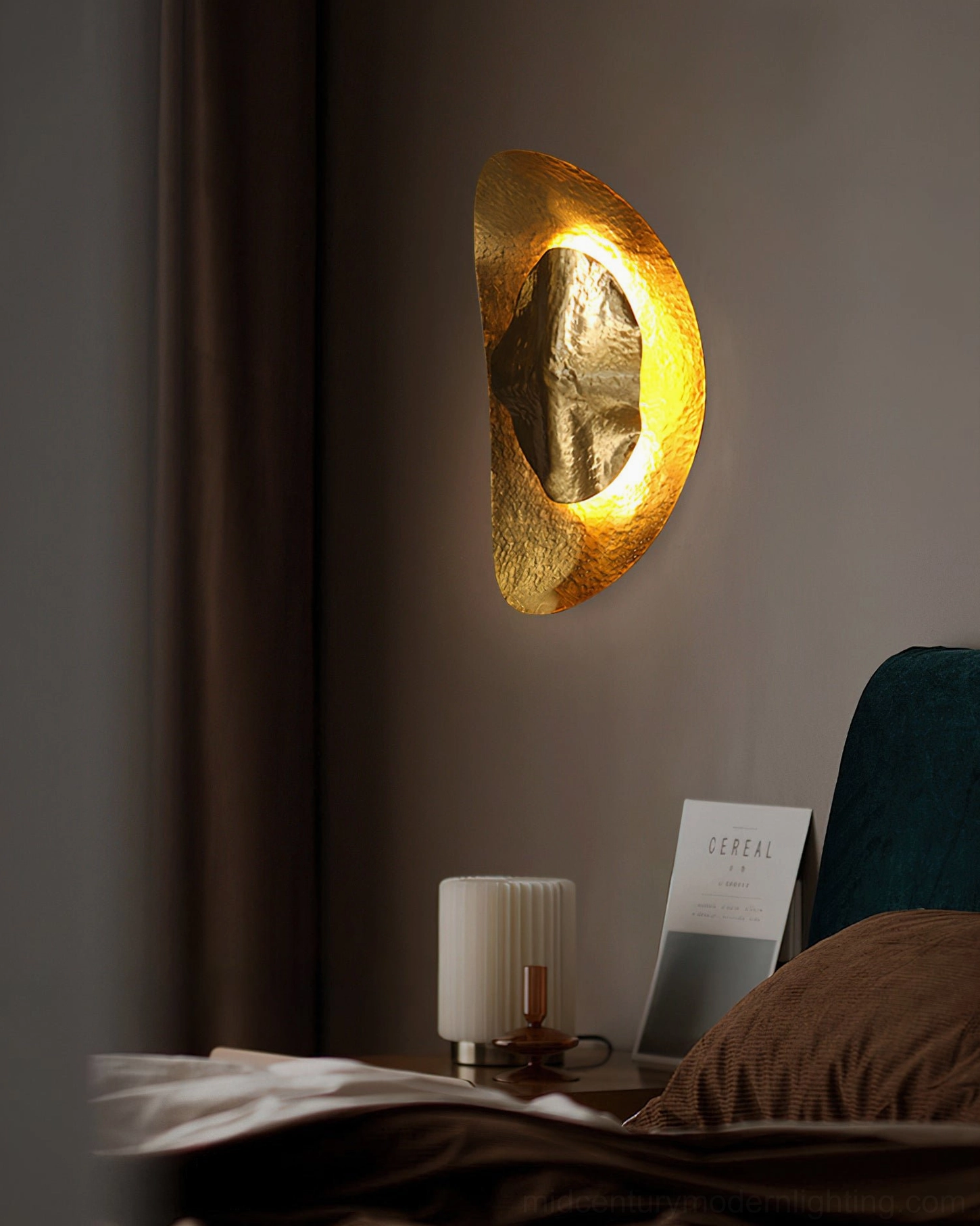 Helios hand-hammered brass wall sconce detail showing planished texture, hidden G9 sockets, and sculptural brass shell construction