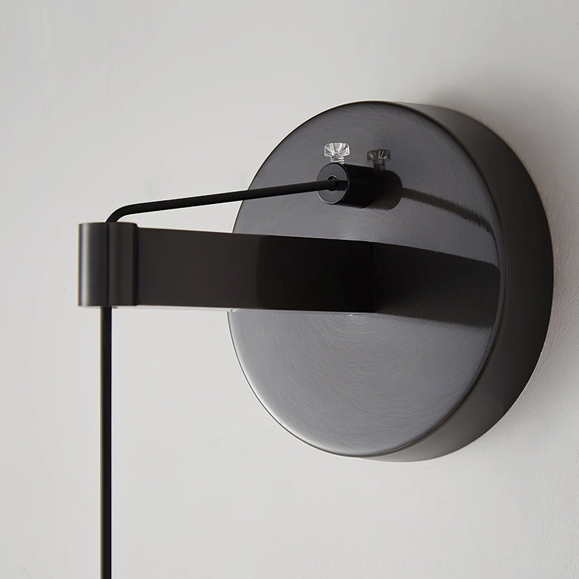 Helmet wall lamp mounting bracket close-up detail adjustable arm matte black metal