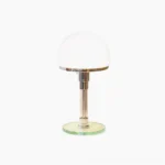 Hemispherical chrome table lamp with frosted glass dome and metal base, studio product photography on white background