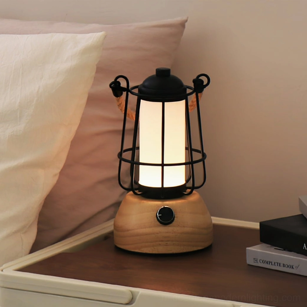 Portable hemp rope lantern table lamp on bedside tray with pillow and book creating cozy bedroom lighting
