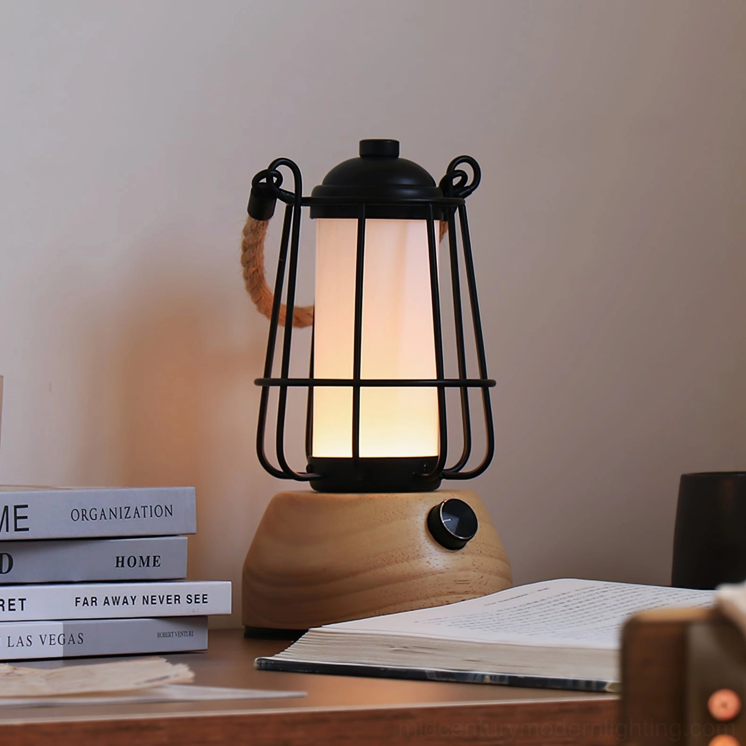 Hemp rope lantern cordless LED lamp on study desk with stacked books and open reading for workspace lighting