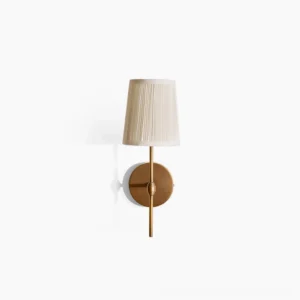 Henley brass wall sconce with pleated fabric shade studio view on white background