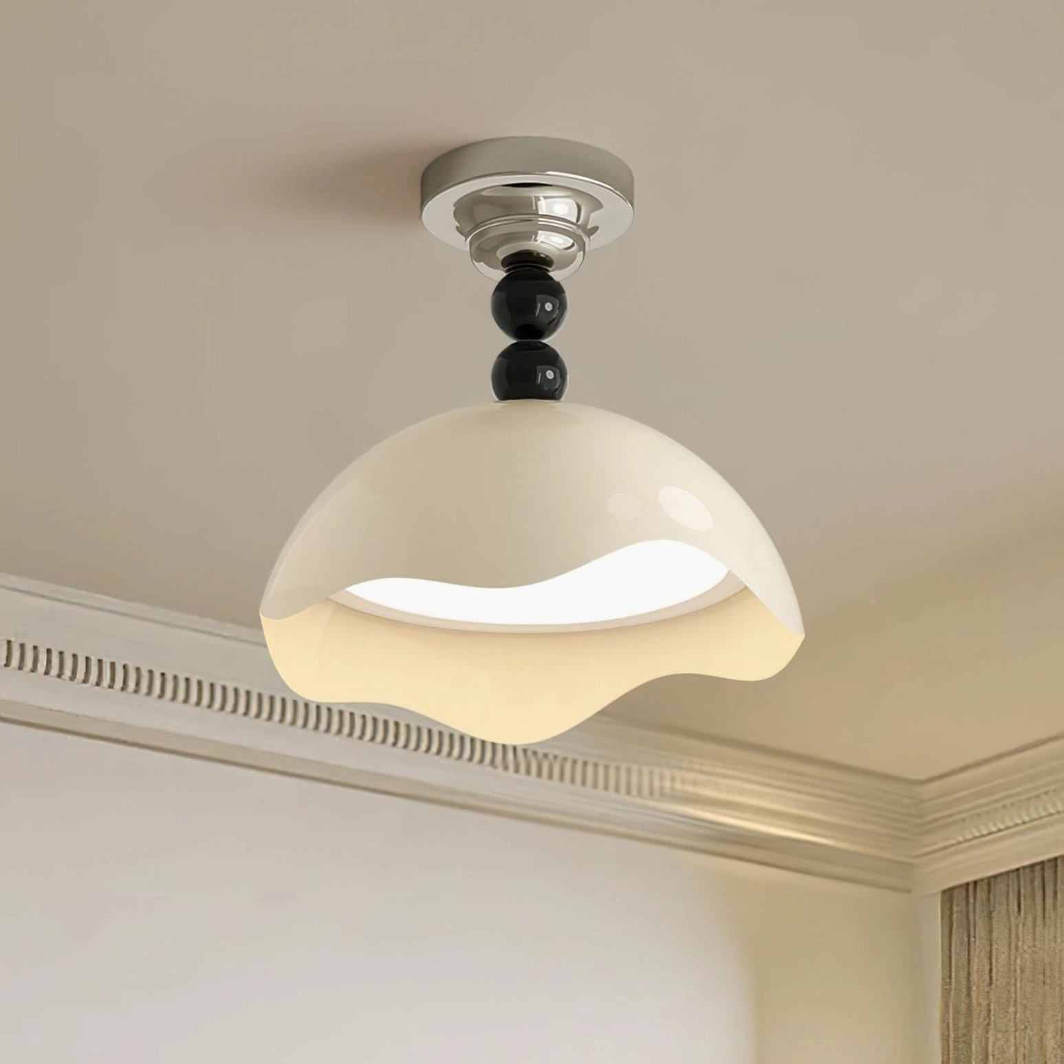 Henry wavy ceiling lamp installed in bedroom with crown molding, creating warm ambient lighting in contemporary minimalist cream interior design