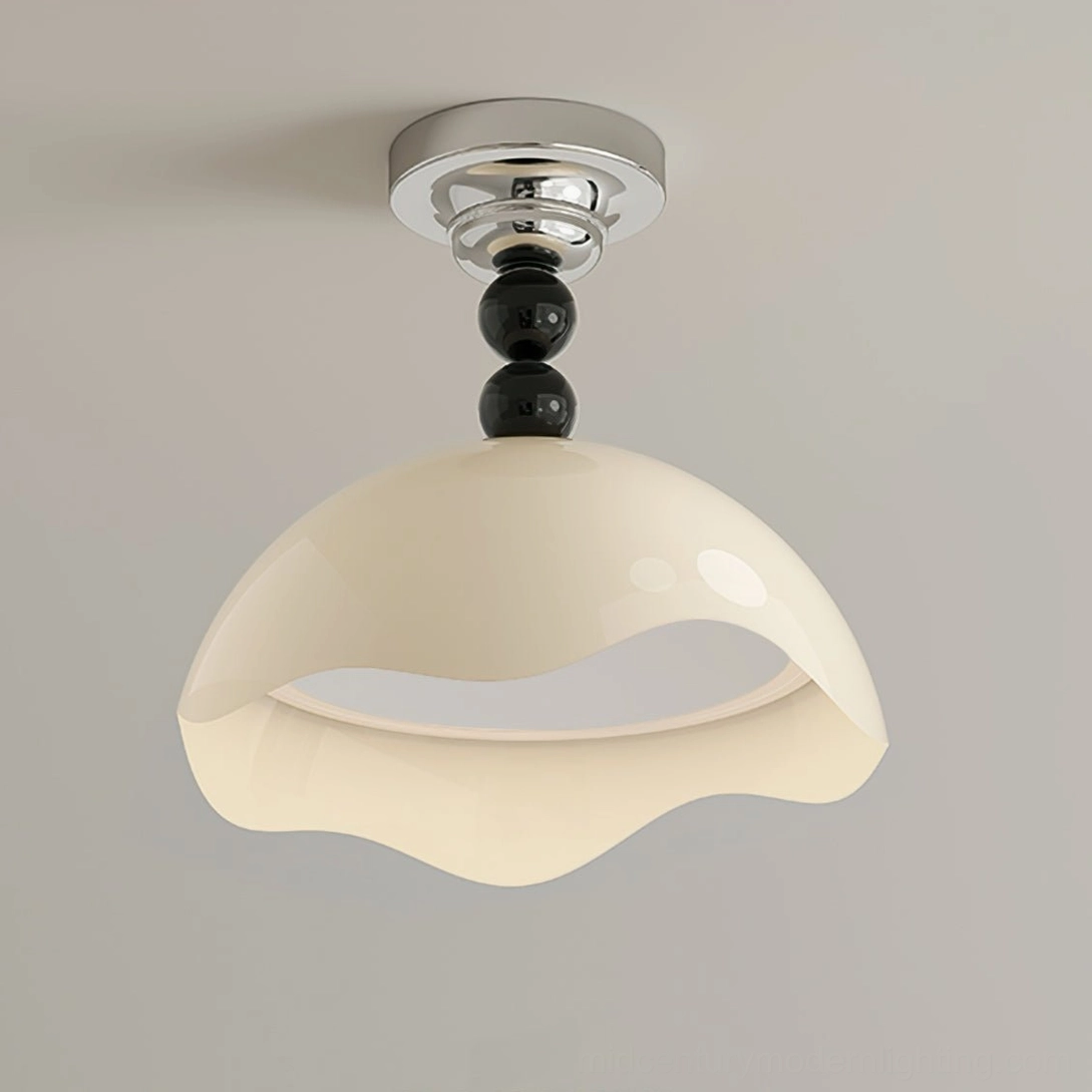 Close-up side view of Henry ceiling lamp showing chrome ceiling mount hardware and black spherical decorative accent details