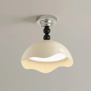 Henry ceiling lamp mounted flush to ceiling, overhead view displaying warm diffused LED light and glossy cream acrylic finish with black metal details
