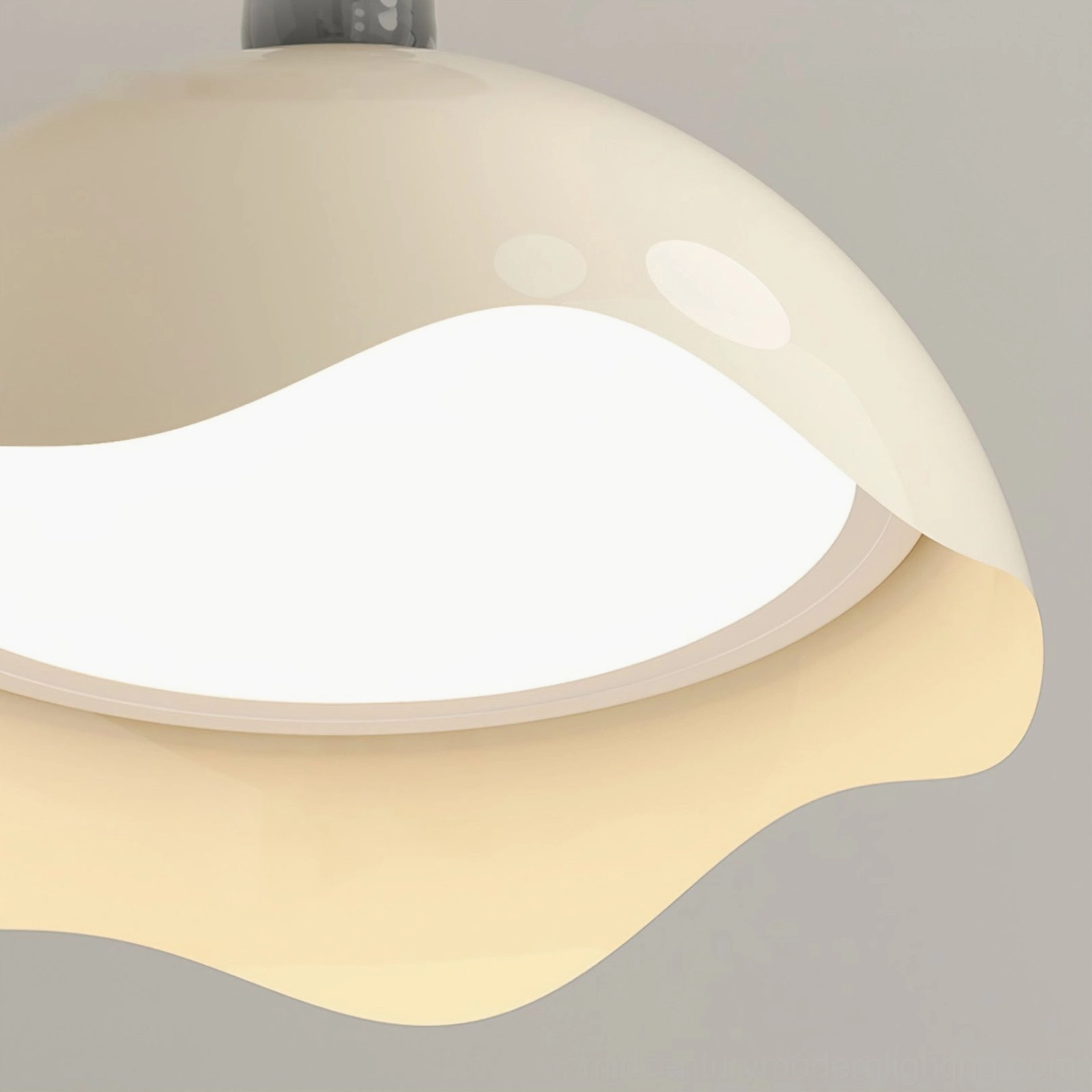 Interior close-up of Henry lamp shade showing irregular wavy edge design and warm LED light diffusion pattern through acrylic