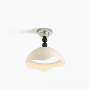Henry wavy cream ceiling lamp with black accents, front three-quarter view showing sculptural shade design and modern minimalist aesthetics