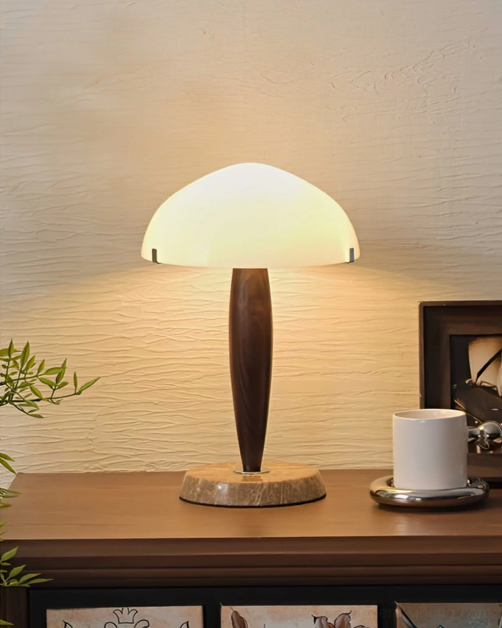 Herman lit table lamp on console with warm ambient glow in minimalist home interior with wall art