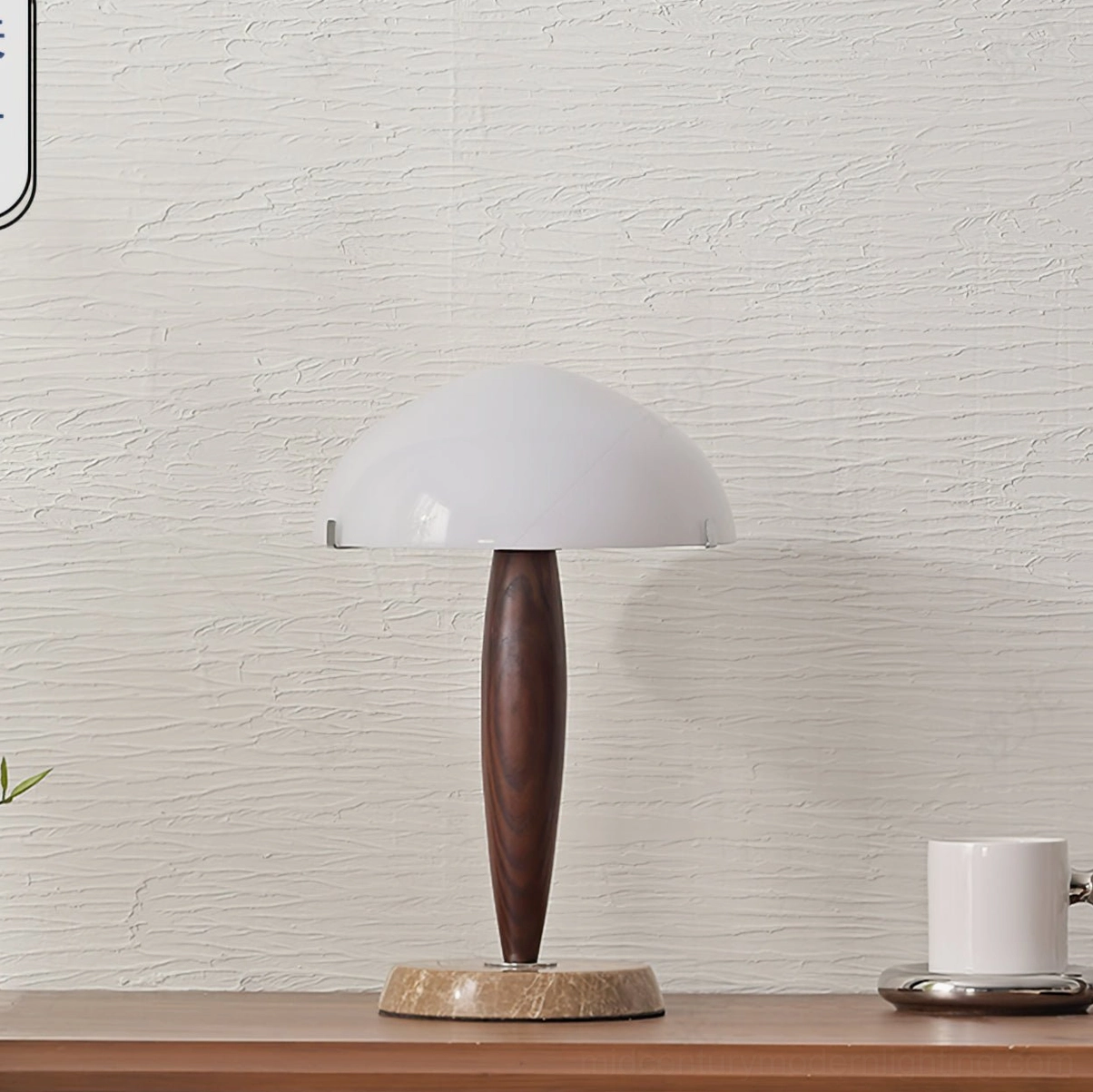 Herman marble table lamp with white dome shade on wooden shelf, side profile showing sculptural design