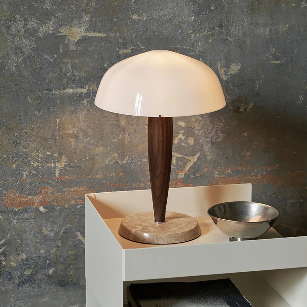 Herman marble table lamp on white display shelf with metal bowl, weathered concrete wall backdrop
