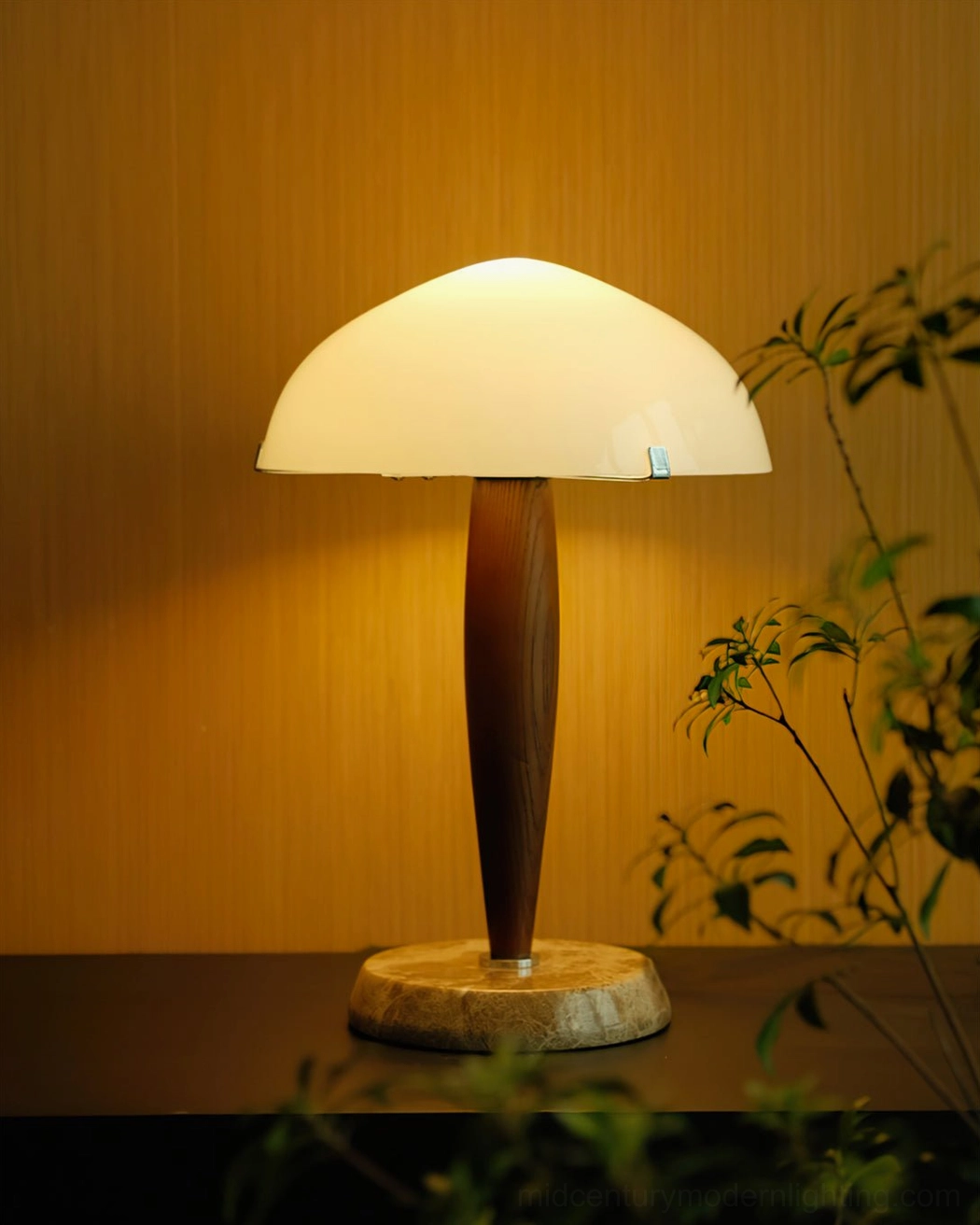 Herman illuminated table lamp casting warm light in living room with plants and yellow wall background