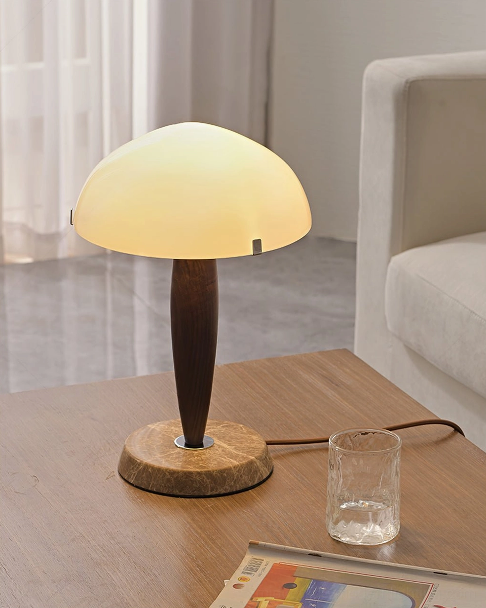 Herman modern table lamp with solid wood base and white shade in contemporary living room setting
