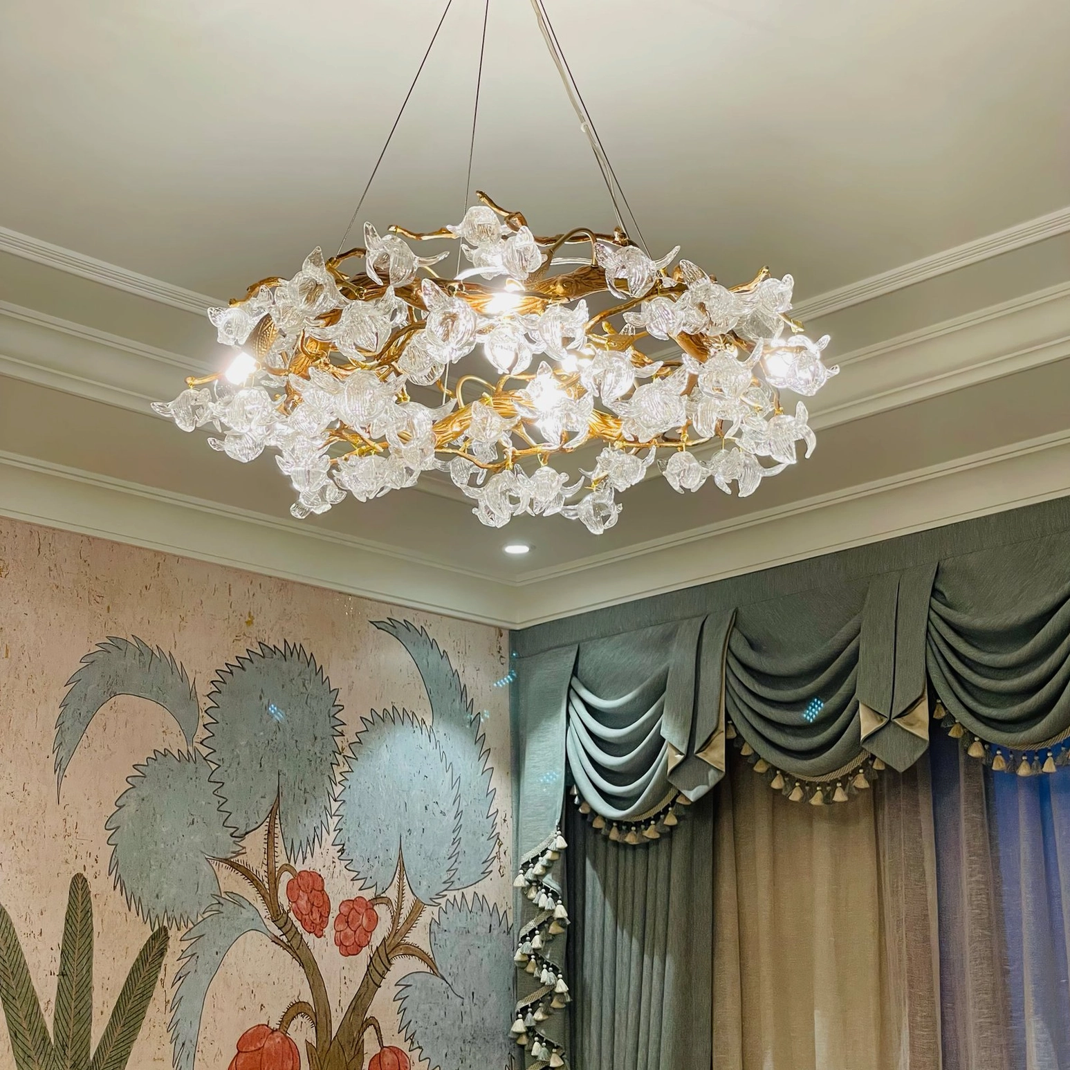Hibiscus crystal chandelier mounted on coffered ceiling showing installation and proportion