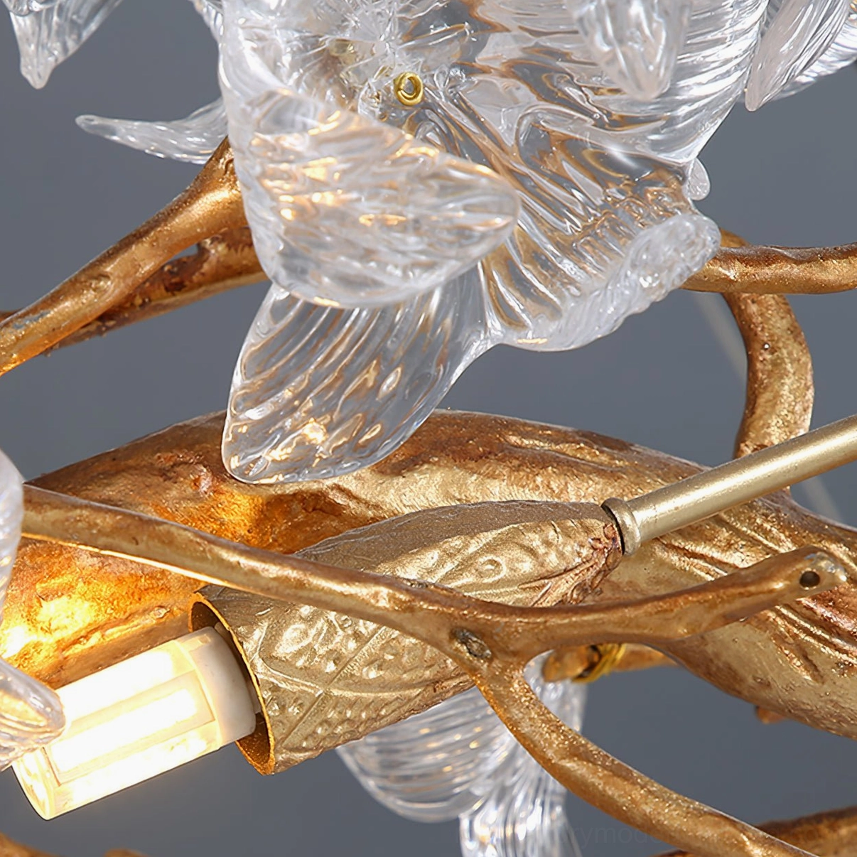 Crystal flower petal detail of mid-century modern hibiscus chandelier showing light refraction