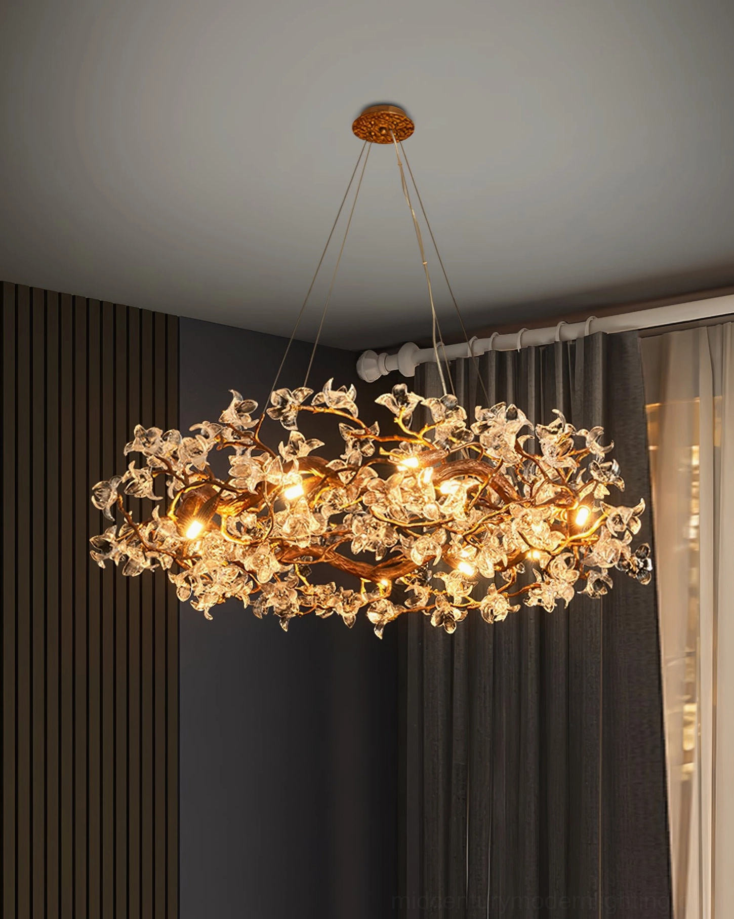 Industrial loft interior with brass hibiscus chandelier providing elegant contrast to raw materials