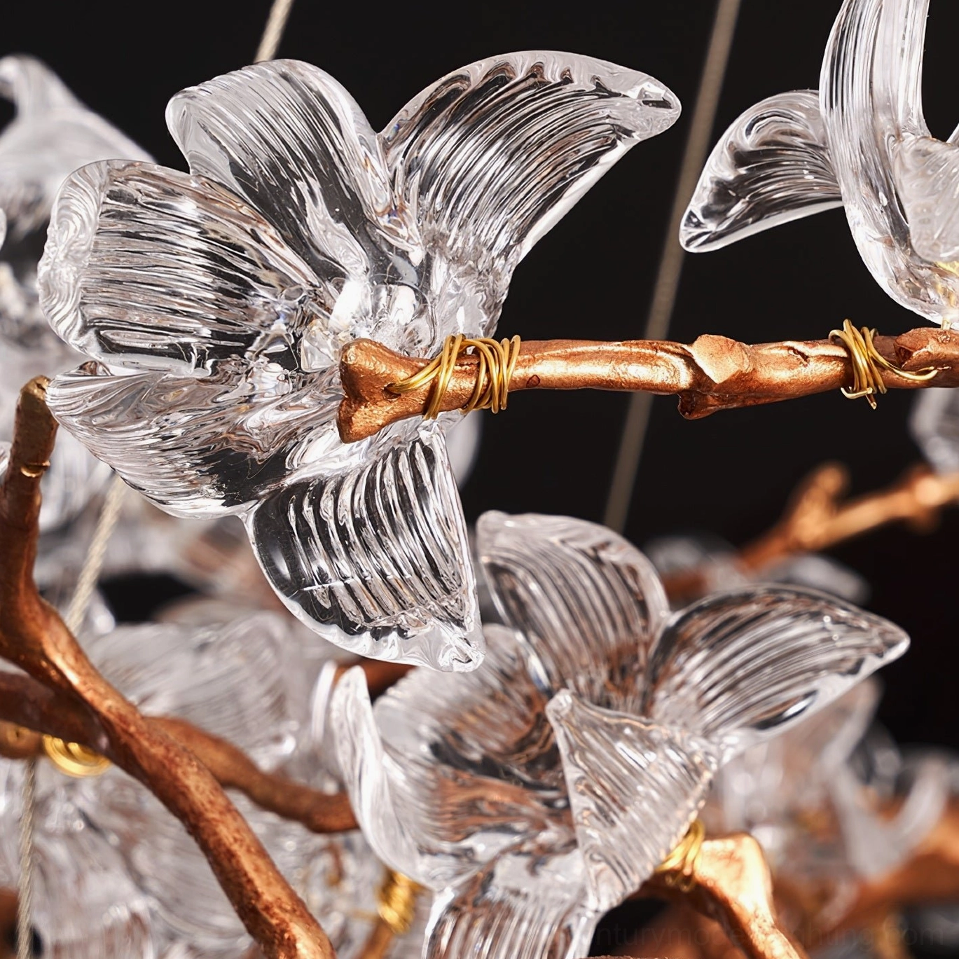 Large hibiscus crystal chandelier commanding presence in grand dining room above table setting