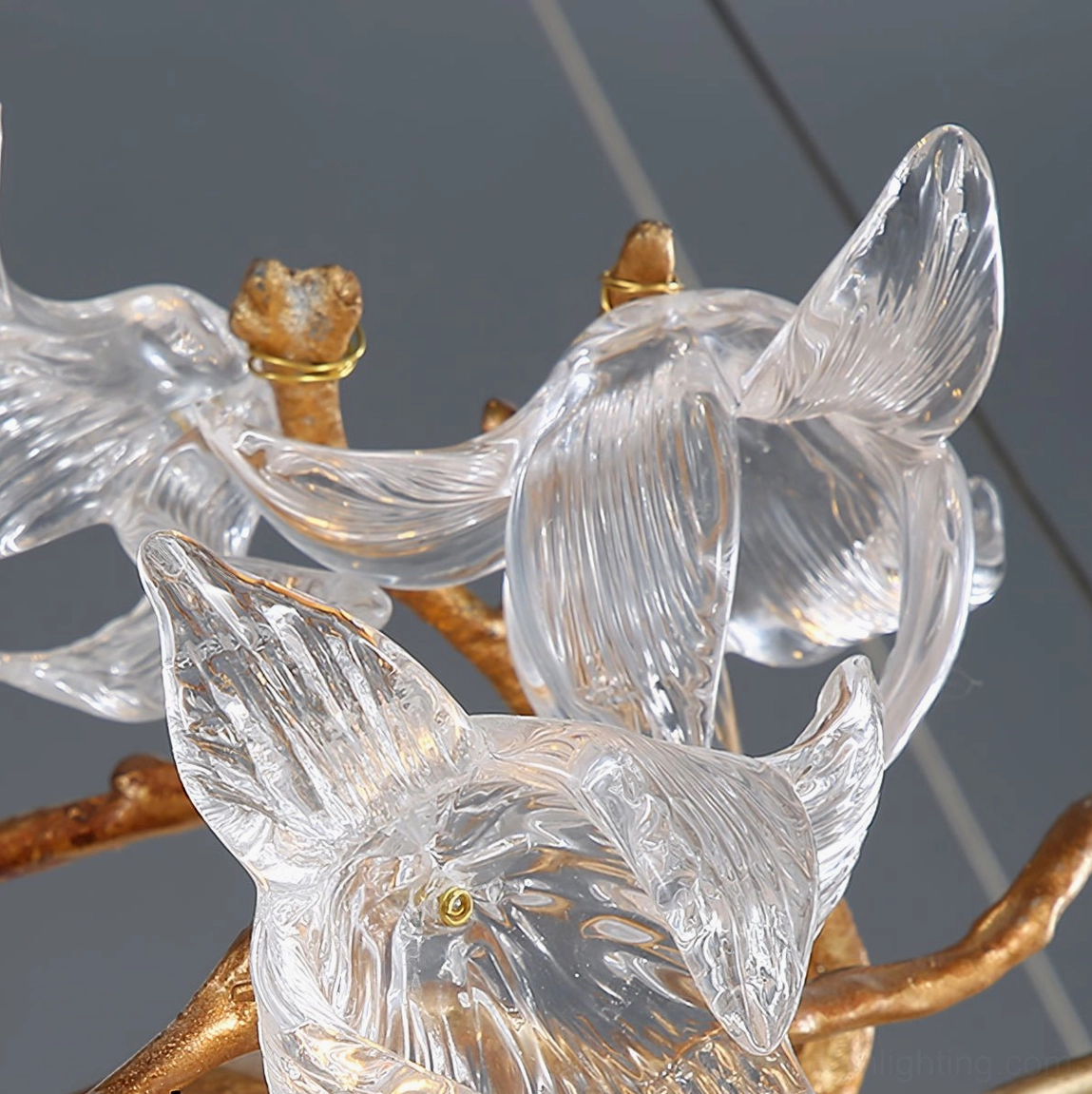 Hibiscus crystal chandelier ornamental details showing artistic brass flower stem work
