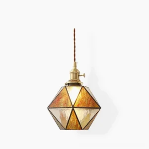 Hiro geometric pendant lamp with faceted amber stained glass and brass frame, front studio view showing retro mid-century modern design