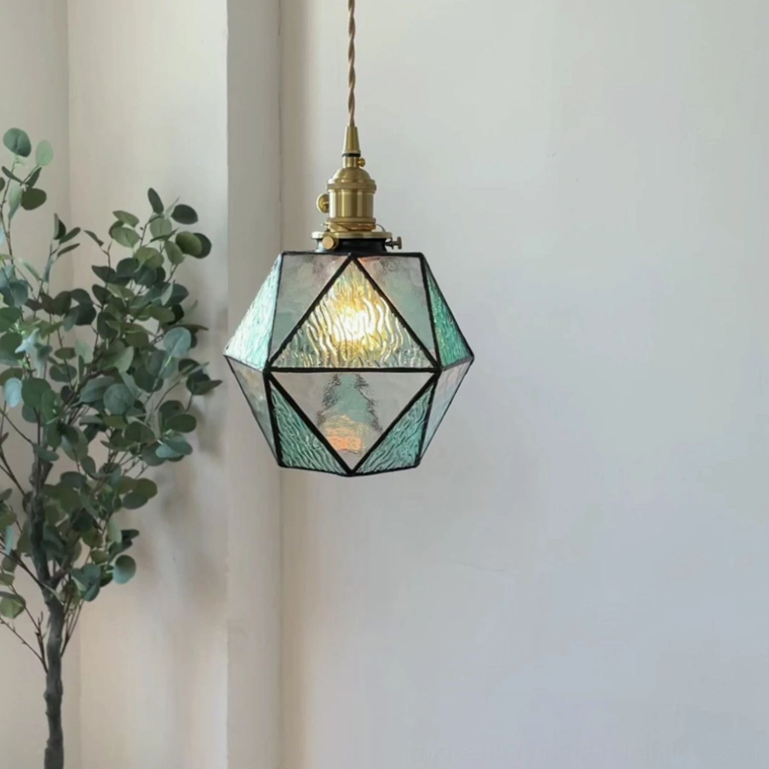 Hiro handmade glass pendant lamp with visible brass welding seams, artisanal craftsmanship detail and construction