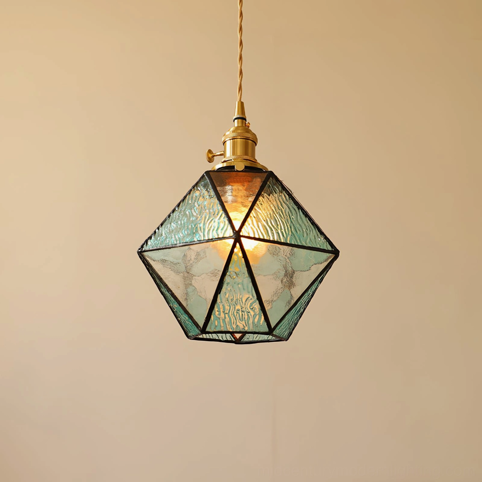 Hiro mint green rippled glass pendant lamp with brass hardware, overhead angle view highlighting faceted glass pattern and hanging wire