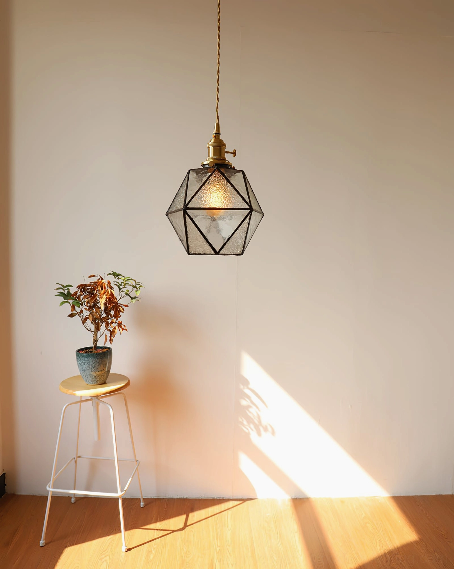 Hiro pendant lamp installation example, ceiling mount with standard suspension wire in contemporary interior setting