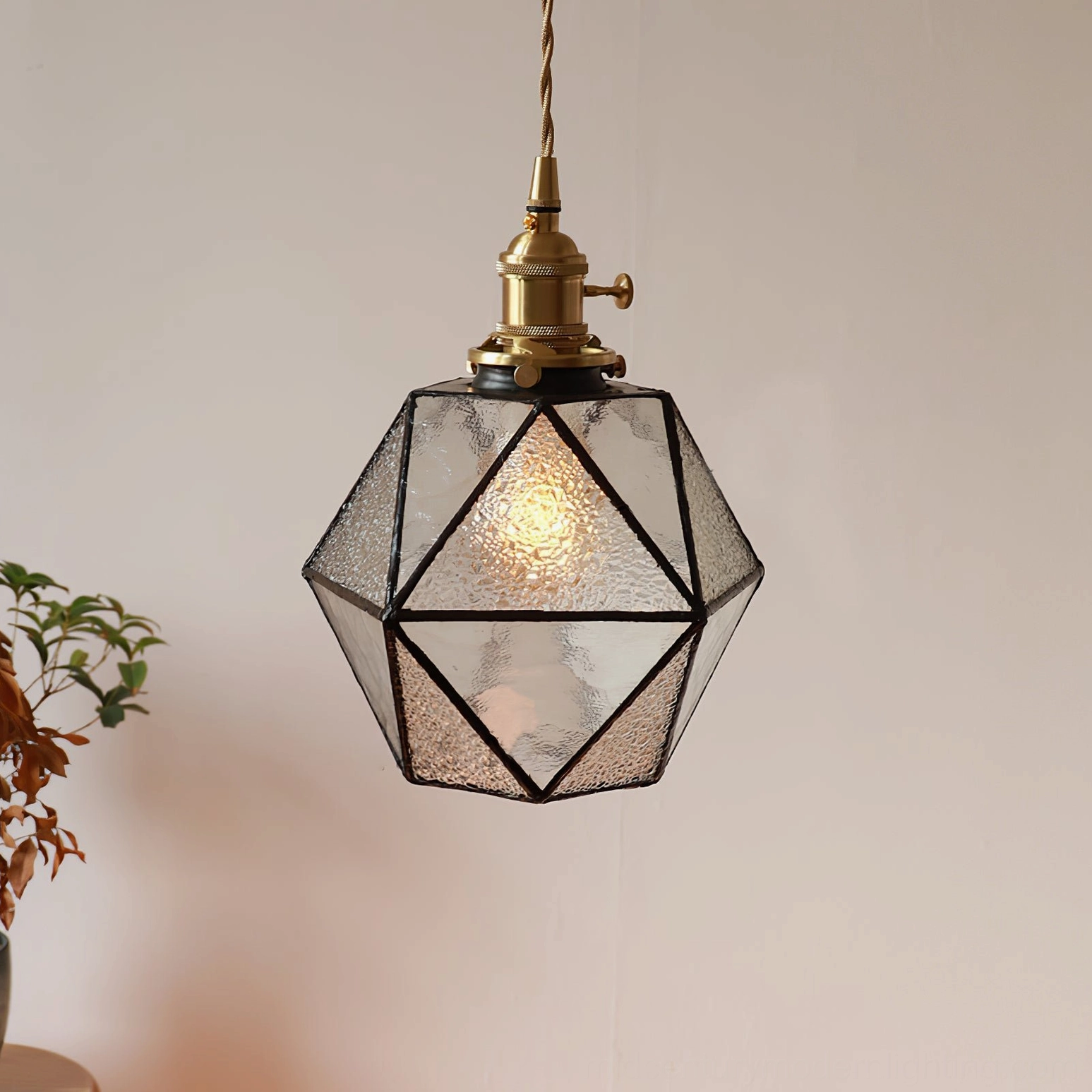 Hiro pendant lamp with Edison bulb illuminated, warm vintage ambient lighting in retro interior setting